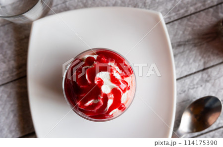 Sweet dessert strawberry mousse whipped to delicate foam is served in small bowl for breakfast. Sweet dessert strawberry mousse whipped to delicate foam is served in small bowl for breakfast. 114175390