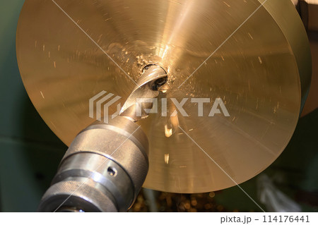 The hole drilling process on brass material parts by lathe machine. The hole drilling process on brass material parts by lathe machine. 114176441