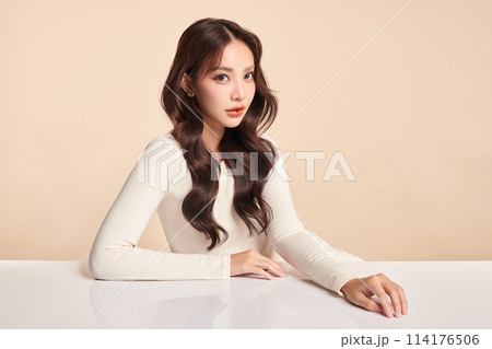 Beautiful young asian woman with clean fresh skin on beige background, Face care, Facial treatment, Cosmetology, beauty and spa, Asian women portrait. 114176506