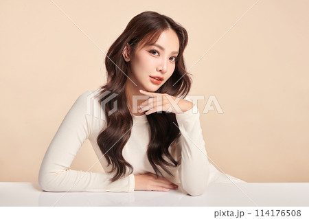 Beautiful young asian woman with clean fresh skin on beige background, Face care, Facial treatment, Cosmetology, beauty and spa, Asian women portrait. 114176508