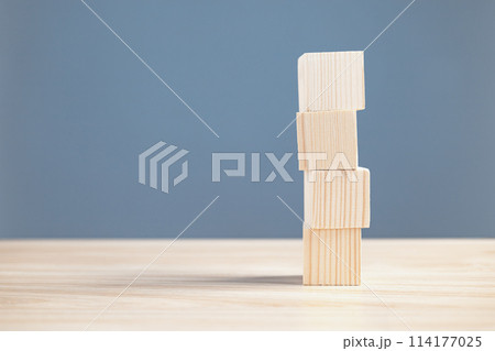 wood empty four blocks stack on table and blue blackground with copy space for text or symbols, development concept for growth success process. 114177025