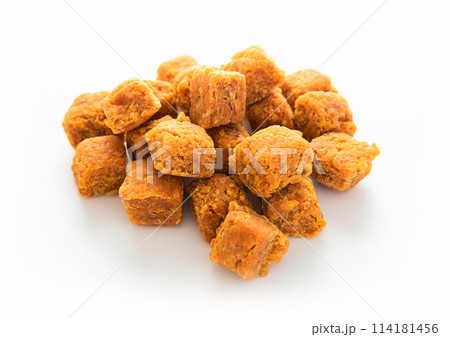 Pile of dried sweet mango balls on white background.Macro Pile of dried sweet mango balls on white background.Macro 114181456