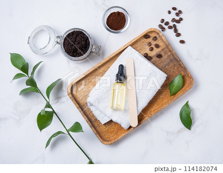 Flat lay with natural ingredients for home body coffee scrub with coffee beans, towel  114182074
