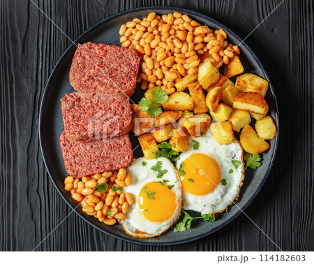 corned beef, baked beans, potatoes and fried eggs 114182603