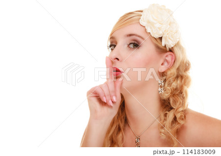 Wedding. Bride asking for quiet. Finger on lips. 114183009