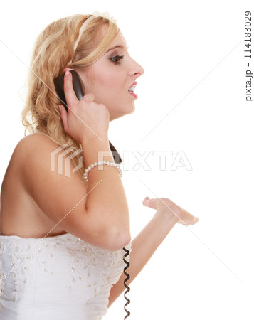 Wedding angry woman bride talking on phone. 114183029