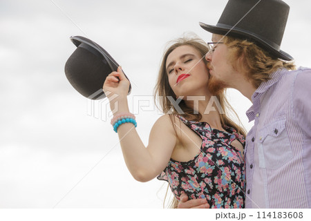 Vintage couple against sky Vintage couple against sky 114183608
