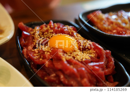 Beef tartare is a traditional Korean dish made by seasoning finely chopped beef without cooking it at all. 114185269