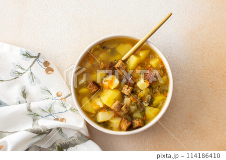 Pea soup with fried croutons Pea soup with fried croutons 114186410