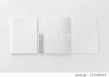 Corporate stationery set mockup. Presentation folders, letterhead and pencils at white textured paper background. Corporate stationery set mockup. Presentation folders, letterhead and pencils at white textured paper background. 114188424