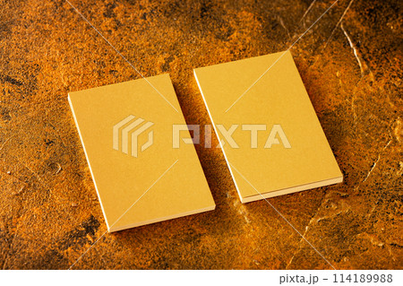 Mockup of two veritcal golden foil business cards at golden textured luxury background. 114189988