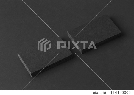Mockup of two blank business cards stacks at black textured background. 114190000