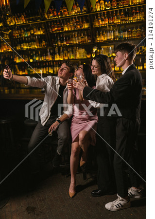 Young people at party in nightclub with patriotic flags 114191274