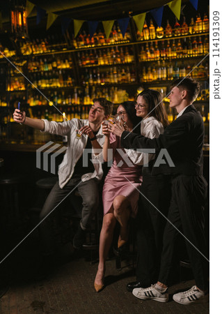Meeting guys and girls after work in stylish restaurant 114191309