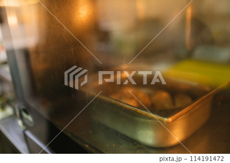 Delightful process of baking pastry in oven in kitchen Delightful process of baking pastry in oven in kitchen 114191472