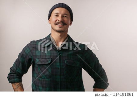 smart professional expert handyman wearing knitted hat isolated in studio 114191861
