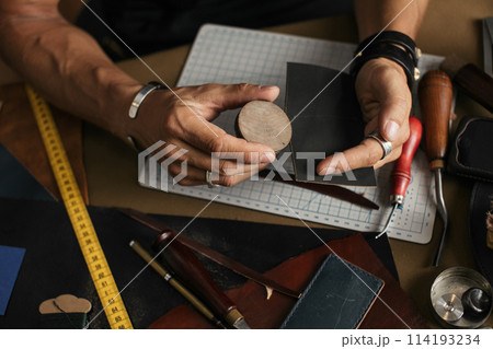 Care for leather shoes over wooden background. 114193234