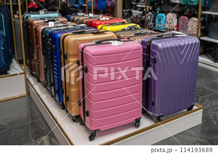 Large selection of colorful suitcases in store. Travel suitcases for sale at the mall. Large selection of colorful suitcases in store. Travel suitcases for sale at the mall. 114193689
