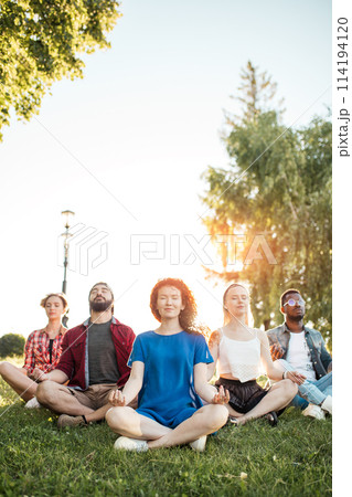 People yoga in a park People yoga in a park 114194120