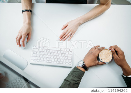 Business teamwork with laptop, mobile phone in coffee shop 114194262