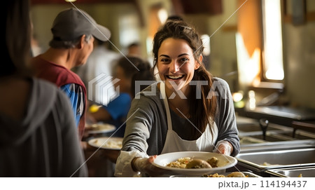 The  shows a young woman serving food at a soup kitchen 114194437