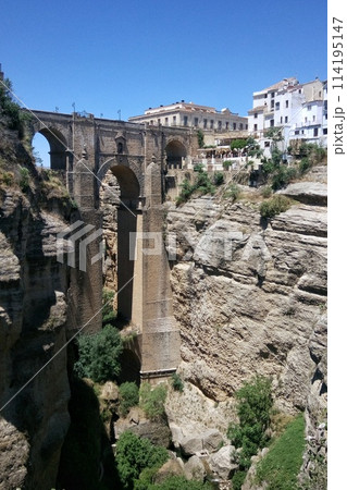 Puente Nuevo arch bridge over the tajo Gorge at Ronda village, Spain. Tourist viewpoint cliff in Ronda province of Malaga, Andalucia 114195147