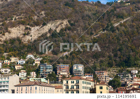 Italian city of Como in Alps mountains. Beautiful houses in mountain. Travel. Buildings. Tourism concept. Italy, Lombardy, the province of Milan. Como Lago. 114195691