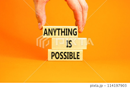 Anything is possible symbol. Concept words Anything is possible on beautiful wooden blocks. Beautiful orange table orange background. Businessman hand. Business anything possible concept. Copy space. 114197903