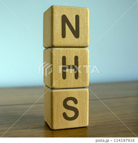 Concept word NHS (National Health Service) on cubes on a beautiful blue background. Concept word NHS (National Health Service) on cubes on a beautiful blue background. 114197918