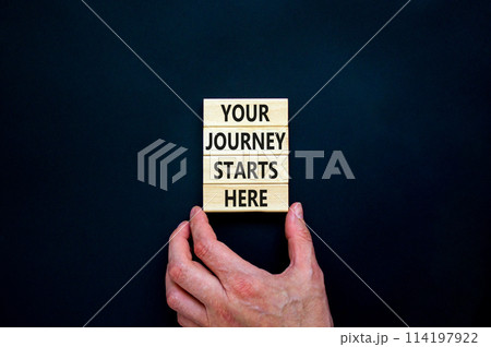 Your journey starts here symbol. Concept words Your journey starts here on wooden blocks on a beautiful black table black background. Business, motivational and your journey starts here concept. 114197922