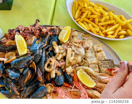 Seafood platter with musselspus, squid, squidpus and French fries a Marsaxlokk cafe, Malta Seafood platter with musselspus, squid, squidpus and French fries a Marsaxlokk cafe, Malta 114200258