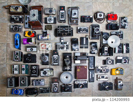 Eclectic Camera Collection Displayed on Tile Floor 114200993