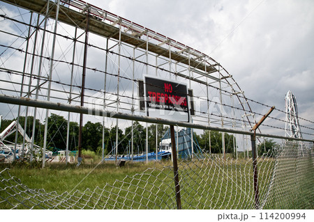 Abandoned Roller Coaster in Overgrown Amusement Park, No Trespassing Warning Abandoned Roller Coaster in Overgrown Amusement Park, No Trespassing Warning 114200994