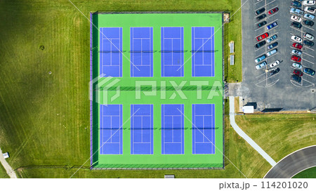 Aerial above six tennis courts next to parking lot with vehicles, Muncie Central, Muncie, Indiana 114201020