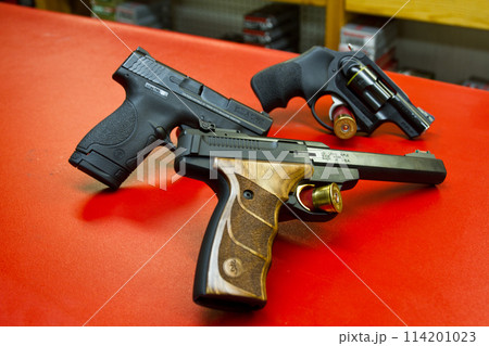 American Made Handguns on Vibrant Red Display - Indoor Shooting Range 114201023
