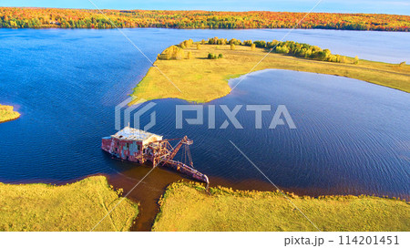 Aerial View of Abandoned Quincy Dredge in Autumn Lake Landscape 114201451