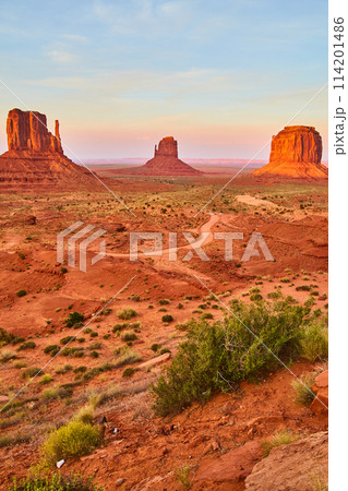 Golden Hour at Monument Valley with Sandstone Buttes and Desert Road Golden Hour at Monument Valley with Sandstone Buttes and Desert Road 114201486
