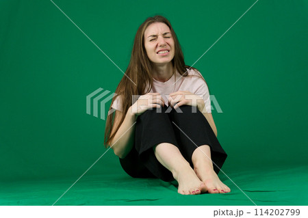 Young woman laughs very loudly studio photography 114202799