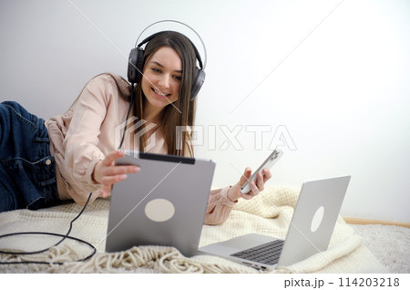 Call center service. Beautiful customer service or sales agent. The telephone operator of the caller or registrar. Copy space. Help, answers, counseling. Above the blurry office background. Call center service. Beautiful customer service or sales agent. The telephone operator of the caller or registrar. Copy space. Help, answers, counseling. Above the blurry office background. 114203218