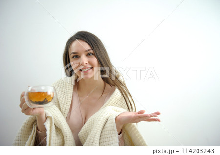 Woman drinking a glass of tea 114203243