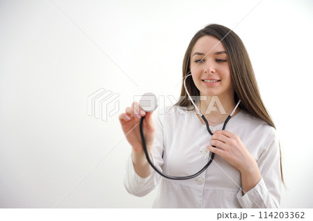 Closeup portrait of a female doctor with stethoscope Closeup portrait of a female doctor with stethoscope 114203362
