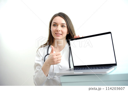banner girl with laptop in headphones communicates online conference with friends waving a lot of space for text ad gadgets online courses internet social networks Web studio woman beautiful teeth 114203607