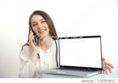 online medicine on the phone female doctor consulting a patient pleasant communication to help recovery patient gratitude laptop with a white screen in a hospital on a white background 114203612