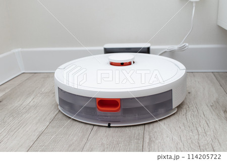 robot vacuum cleaner at the charging station. 114205722