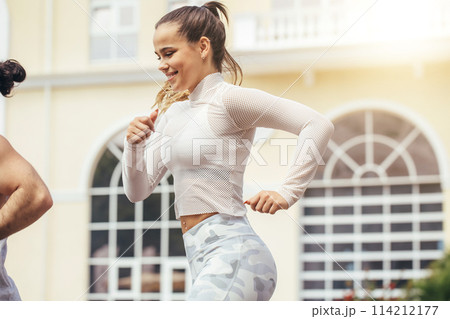 fitness, sport, people and lifestyle concept - happy couple with earphones running outdoors 114212177