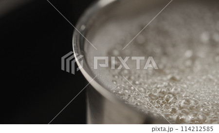 closeup of pasta in boiling water in saucepan 114212585