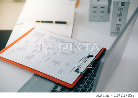 Real estate agent talked about the terms of the home purchase agreement and asked the customer to sign the documents to make the contract legally, Home sales and home insurance concept. 114217858