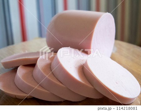 Meat Delicacy Close-Up. Close-up of sausage slices, perfect for food ads. 114218081