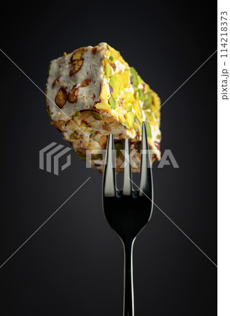Traditional Turkish delight on a fork. Traditional Turkish delight on a fork. 114218373