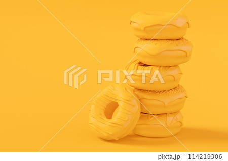 Stack of glazed donut with sprinkles on plain monochrome yellow color 114219306